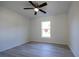 Bedroom features a ceiling fan and a sun-filled window, creating a serene retreat at 8873 Sw 139Th Place Rd, Ocala, FL 34473