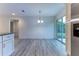 Bright dining room with sliding glass doors and hardwood floors at 8873 Sw 139Th Place Rd, Ocala, FL 34473