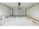 Empty garage with high ceilings and ample space at 8873 Sw 139Th Place Rd, Ocala, FL 34473