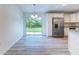 Kitchen features stainless steel appliances and a sliding glass door to backyard at 8873 Sw 139Th Place Rd, Ocala, FL 34473