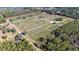 Aerial view of a large property with numerous trees at 16385 Nw 112Th Ct, Reddick, FL 32686