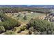Aerial view of a large property with numerous trees at 16385 Nw 112Th Ct, Reddick, FL 32686