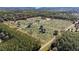 Aerial view of expansive property with rows of trees at 16385 Nw 112Th Ct, Reddick, FL 32686