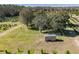 Aerial view of a house and surrounding land at 16385 Nw 112Th Ct, Reddick, FL 32686
