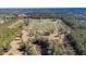 Aerial view of a large property with numerous trees at 16385 Nw 112Th Ct, Reddick, FL 32686