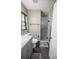 Clean bathroom with gray vanity, shower, and toilet at 16385 Nw 112Th Ct, Reddick, FL 32686