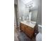 Light and bright bathroom with a vanity, toilet and mirror at 16385 Nw 112Th Ct, Reddick, FL 32686