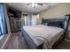 Spacious bedroom with large bed, dresser, and TV at 16385 Nw 112Th Ct, Reddick, FL 32686