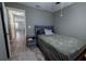Cozy bedroom with a comfortable bed and nightstand at 16385 Nw 112Th Ct, Reddick, FL 32686