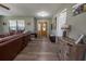 Bright entryway with wood flooring and a coat rack at 16385 Nw 112Th Ct, Reddick, FL 32686