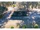 Aerial view of farm equipment parked under a covered area at 16385 Nw 112Th Ct, Reddick, FL 32686