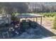 Aerial view of two utility vehicles parked under a covered shelter at 16385 Nw 112Th Ct, Reddick, FL 32686