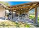Covered patio with seating area, perfect for outdoor dining at 16385 Nw 112Th Ct, Reddick, FL 32686