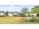 Spacious backyard with seating area and fenced enclosure at 5315 Nw 25Th Loop, Ocala, FL 34482