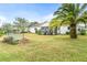 Large backyard featuring a screened porch and landscaping at 5315 Nw 25Th Loop, Ocala, FL 34482