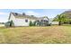 Spacious backyard with screened porch and palm trees at 5315 Nw 25Th Loop, Ocala, FL 34482