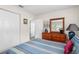 Bright bedroom with double doors and wood dresser at 5315 Nw 25Th Loop, Ocala, FL 34482