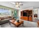 Living room with a wooden entertainment center and comfortable seating at 5315 Nw 25Th Loop, Ocala, FL 34482