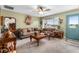 Living room with a sofa, wooden coffee table, and a view of the backyard at 5315 Nw 25Th Loop, Ocala, FL 34482