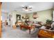 Spacious living room with a beige couch, wooden coffee table, and decorative items at 5315 Nw 25Th Loop, Ocala, FL 34482