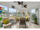 Bright sunroom with seating area and stained glass accents at 5315 Nw 25Th Loop, Ocala, FL 34482