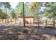 Spacious animal enclosure with wooden shelter and gated access at 5919 Sw 124Th Terrace Rd, Ocala, FL 34481