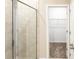 Bathroom with glass shower and closet access at 5919 Sw 124Th Terrace Rd, Ocala, FL 34481