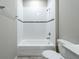 Clean bathroom with white tub and shower at 5919 Sw 124Th Terrace Rd, Ocala, FL 34481