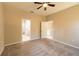 Bright bedroom with carpet flooring and access to bathroom at 5919 Sw 124Th Terrace Rd, Ocala, FL 34481