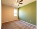 Bedroom with two-tone walls, carpet flooring and ceiling fan at 5919 Sw 124Th Terrace Rd, Ocala, FL 34481