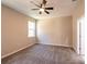 Spacious bedroom with neutral walls and plush carpeting at 5919 Sw 124Th Terrace Rd, Ocala, FL 34481