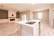 Modern kitchen island with white cabinets and quartz countertops at 5919 Sw 124Th Terrace Rd, Ocala, FL 34481