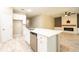 Kitchen island with quartz countertop and sink at 5919 Sw 124Th Terrace Rd, Ocala, FL 34481