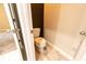 Small powder room with toilet and neutral color scheme at 5919 Sw 124Th Terrace Rd, Ocala, FL 34481