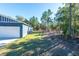 Side yard with wooden fence and grassy area at 5919 Sw 124Th Terrace Rd, Ocala, FL 34481