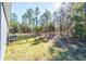 Side yard with wooden fence and grassy area at 5919 Sw 124Th Terrace Rd, Ocala, FL 34481