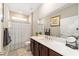 Clean bathroom, featuring a vanity with a white countertop at 8731 Sw 76Th Street Rd, Ocala, FL 34481