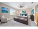 Bright bedroom with a comfy bed and sitting area at 8731 Sw 76Th Street Rd, Ocala, FL 34481