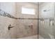 Walk-in shower with glass enclosure and tile surround at 8731 Sw 76Th Street Rd, Ocala, FL 34481