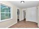 Light-filled interior room with hardwood floors and neutral walls at 2605 W Silver Springs Blvd, Ocala, FL 34475