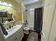 Main bathroom with white vanity and bathtub at 11001 Se Sunset Harbor Rd # B09, Summerfield, FL 34491