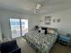 Main bedroom with lake view and king-size bed at 11001 Se Sunset Harbor Rd # B09, Summerfield, FL 34491