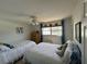 Guest bedroom with two twin-size beds at 11001 Se Sunset Harbor Rd # B09, Summerfield, FL 34491