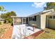 Small patio with bird bath and landscaping at 11436 Sw 84Th Court Rd, Ocala, FL 34481