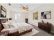 Main bedroom with wood bed frame and dresser at 11436 Sw 84Th Court Rd, Ocala, FL 34481