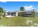 Exterior view of house with backyard and landscaping at 11436 Sw 84Th Court Rd, Ocala, FL 34481