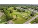 Community overview showcasing homes and golf course at 141 Hickory Course Cir, Ocala, FL 34472