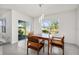 Bright dining area with table and chairs, sliders leading to the patio at 141 Hickory Course Cir, Ocala, FL 34472