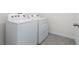 Convenient laundry room with Whirlpool washer and dryer at 141 Hickory Course Cir, Ocala, FL 34472