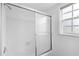 Simple bathroom with shower/tub combo and window at 7874 Midway Drive Ter # V201, Ocala, FL 34472